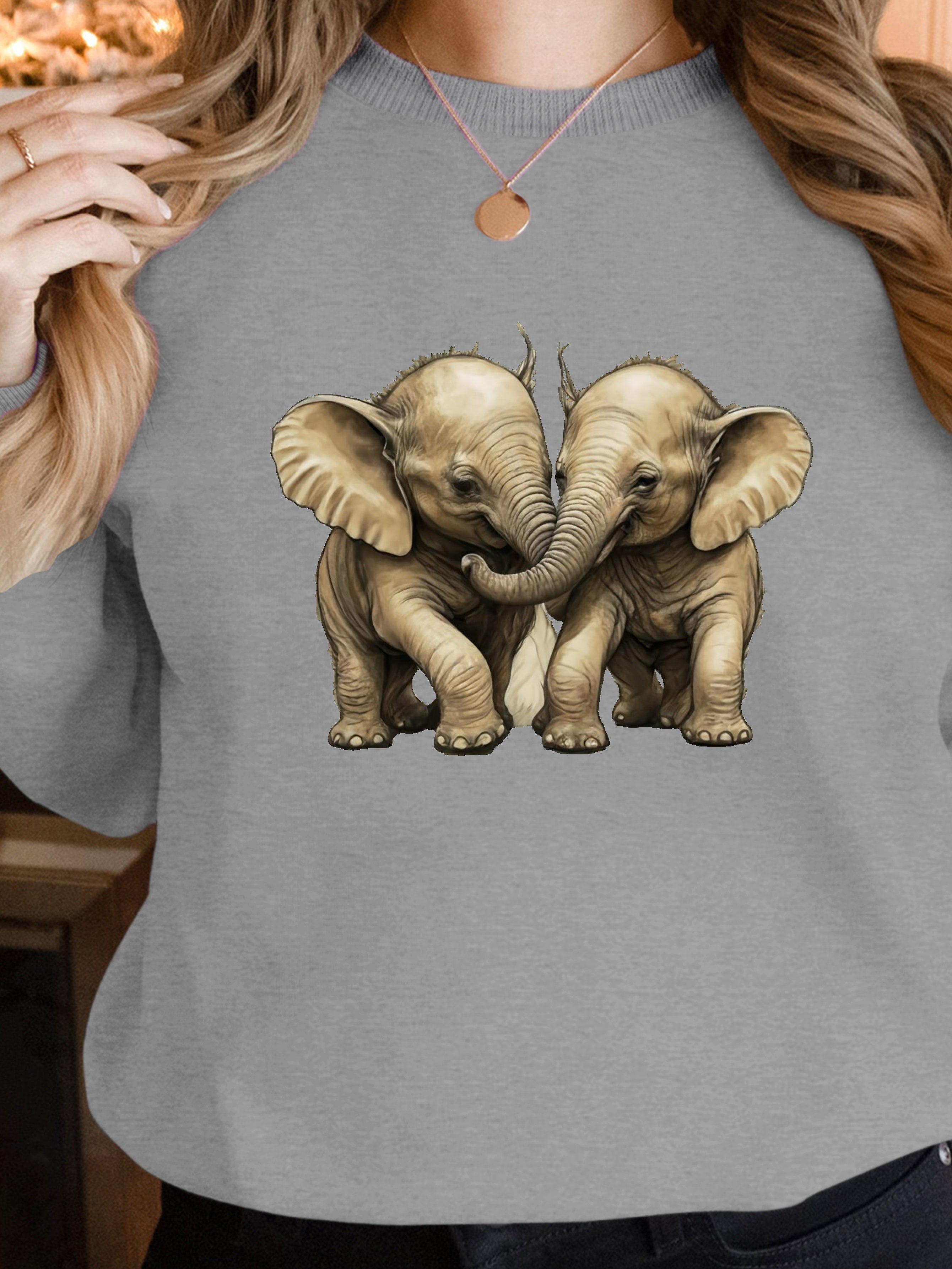 Two baby elephants playing women's sweatshirts