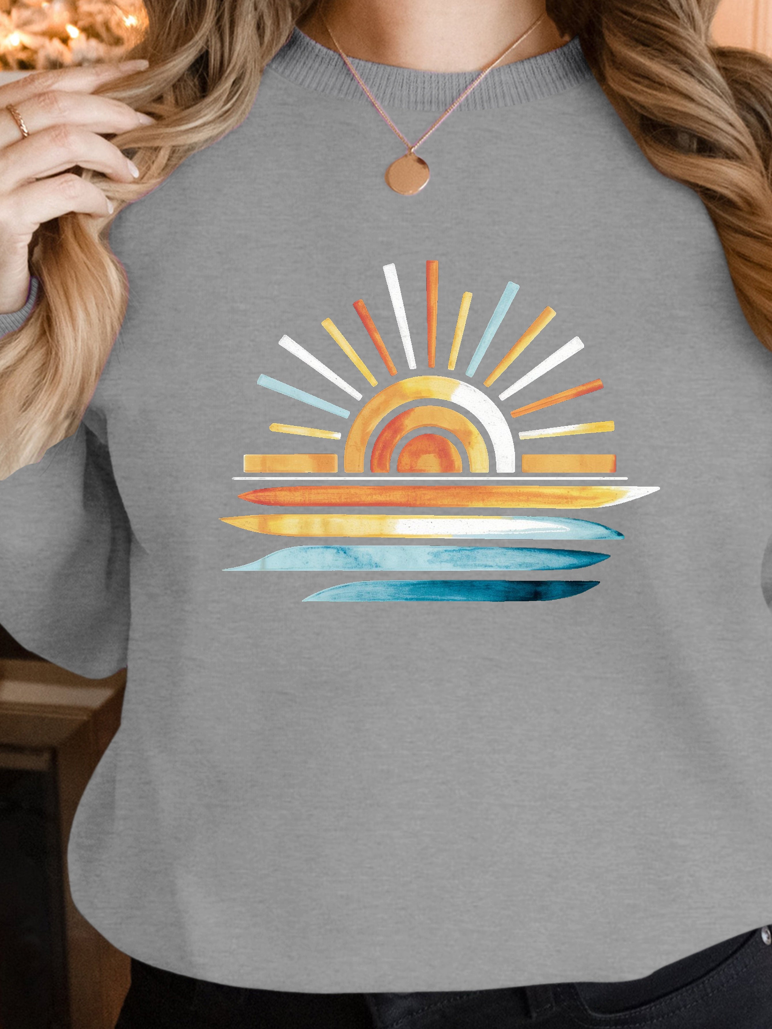 sunset on water women's sweatshirts