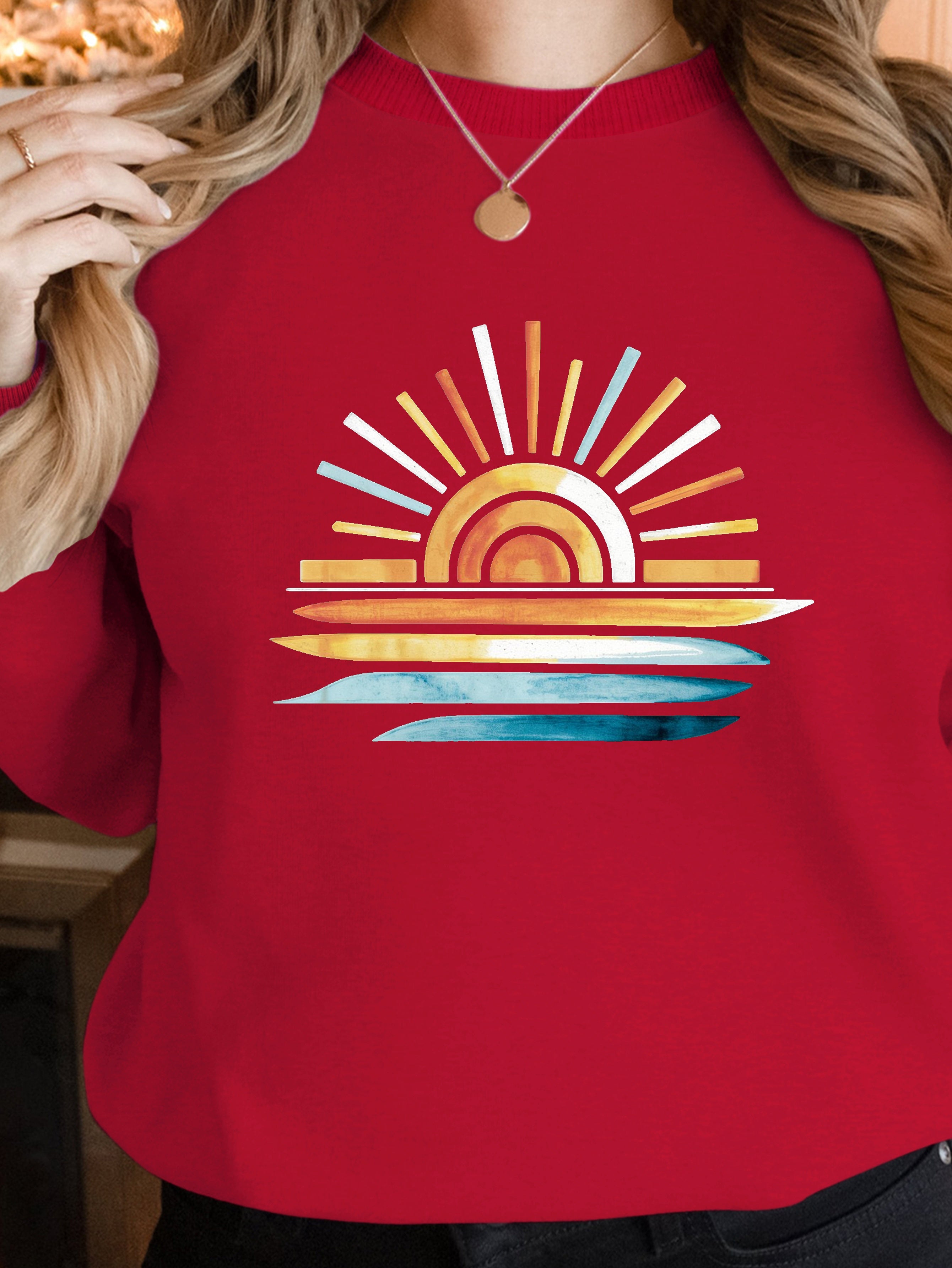 sunset on water women's sweatshirts