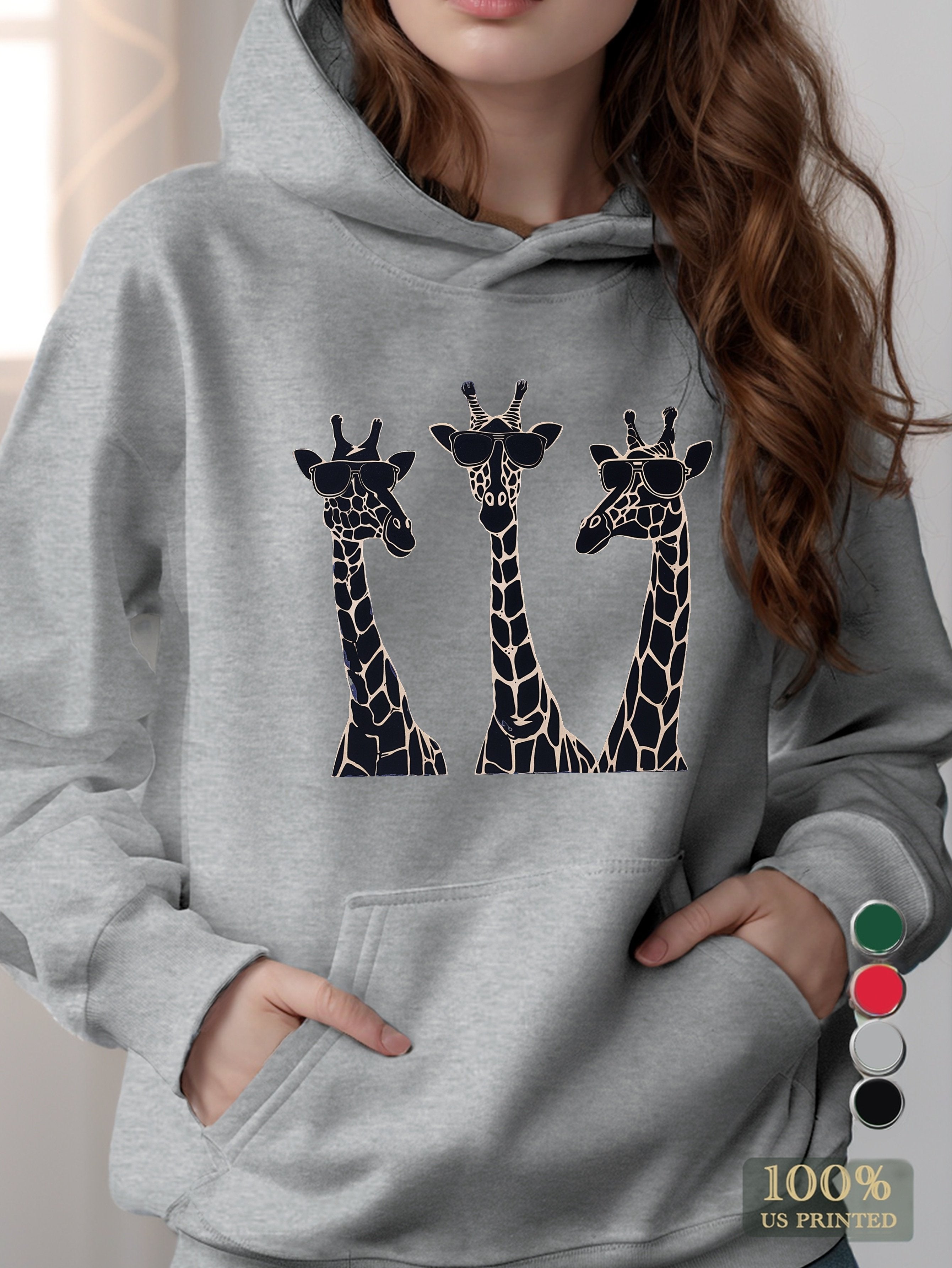 Playful giraffes wearing sunglasses women's hooded sweatshirt