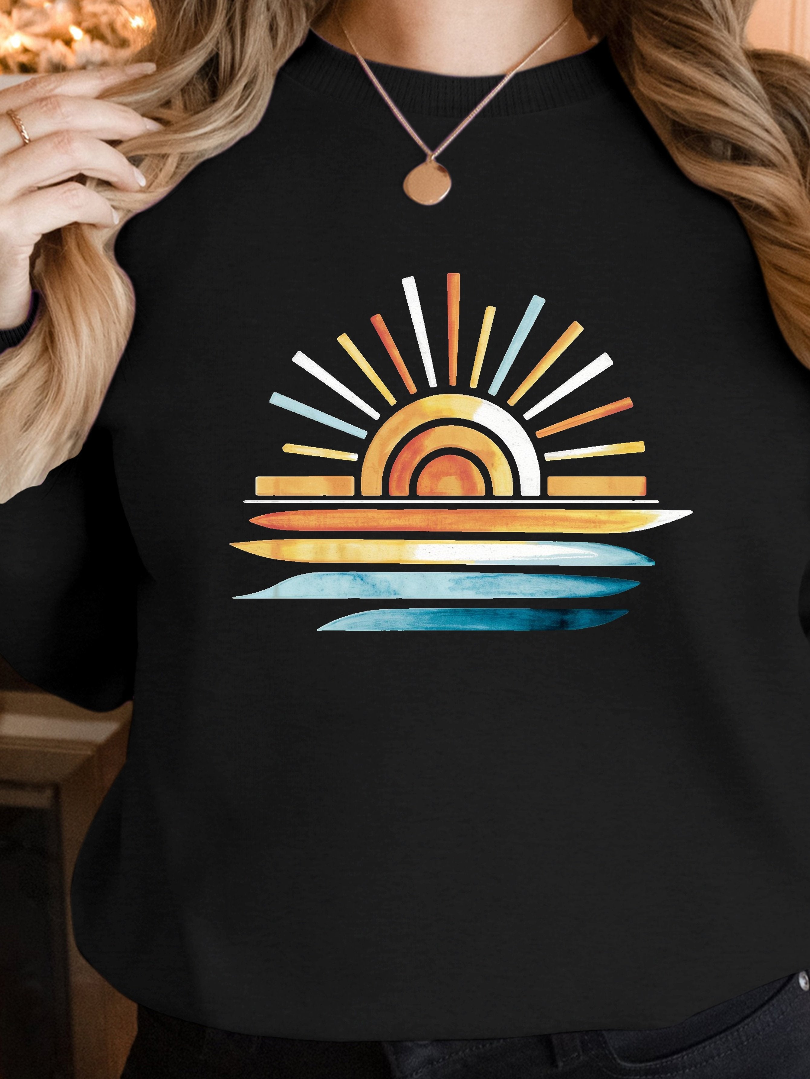 sunset on water women's sweatshirts